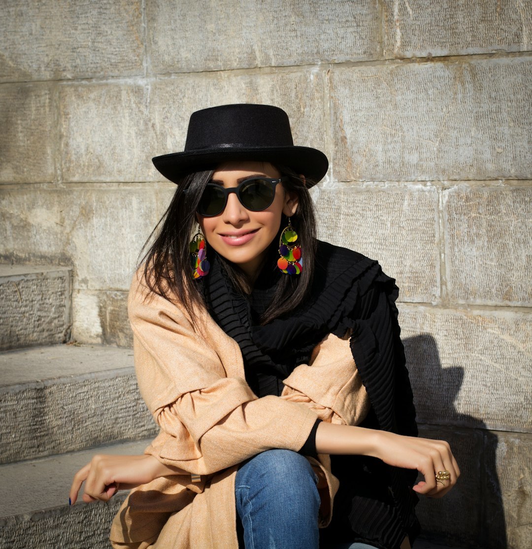 Young Latina woman with bright smile and stylish outfit