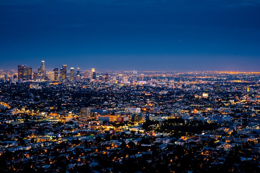 City skyline illuminated at night with glowing lights