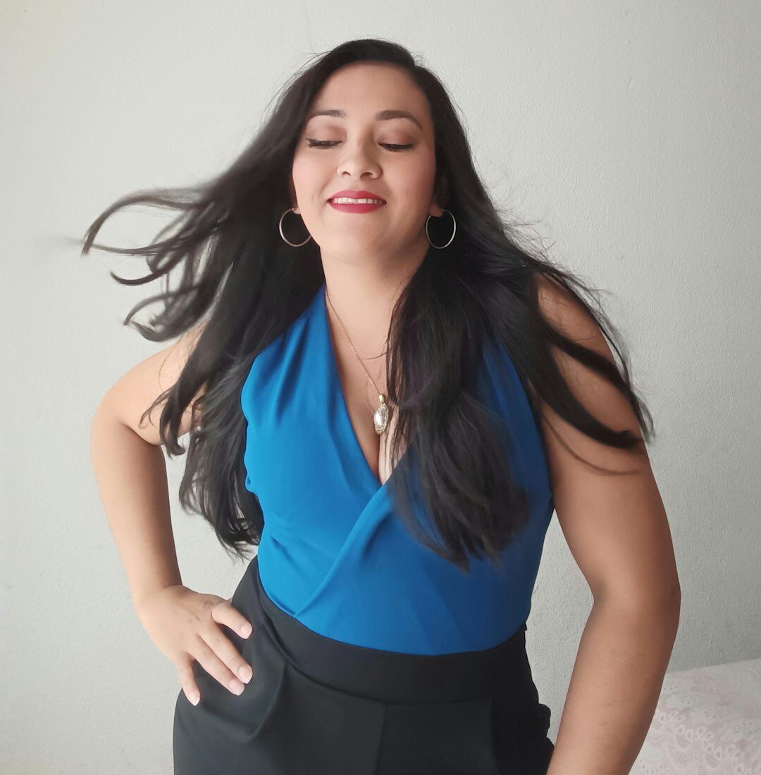 Professional Latina woman with a confident expression