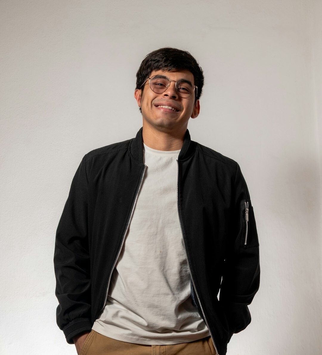 Confident Latino man in casual jacket looking at camera